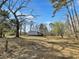 A home in a wooded lot surrounded by mature trees and a large yard at 532 Finlay Ln, Cottageville, SC 29435