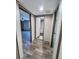 Hallway featuring wood-look floors with doors leading to various rooms, offering privacy at 532 Finlay Ln, Cottageville, SC 29435
