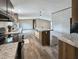 Open kitchen boasts a center island and modern appliances for an inviting space to cook and entertain at 532 Finlay Ln, Cottageville, SC 29435