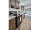 This is a close up view of a modern kitchen with hardwood cabinets and stainless steel appliances at 532 Finlay Ln, Cottageville, SC 29435