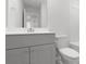 Clean bathroom featuring a toilet, vanity, mirror and combination bathtub and shower at 577 Red Monarch Way, Moncks Corner, SC 29461