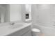 Clean bathroom featuring a vanity sink, toilet, and a shower-tub combination, designed for functionality at 588 Red Monarch Way, Moncks Corner, SC 29461