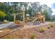 Community playground with swing and slide set in a lush, wooded area at 591 Red Monarch Way, Moncks Corner, SC 29461