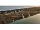 Picturesque aerial view featuring a coastal town with a river, marsh, and the ocean at 702 E Erie Ave, Folly Beach, SC 29439