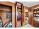 Hallway with wooden shelves, an electrical panel, and an open doorway to the living room at 702 E Erie Ave, Folly Beach, SC 29439