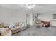 Cozy living area with floral sofa and comfortable seating at 702 E Erie Ave, Folly Beach, SC 29439