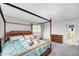 Main bedroom with canopy bed and lots of natural light at 702 E Erie Ave, Folly Beach, SC 29439