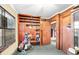 Storage area featuring wooden shelves, a window, and space for organizing household items at 702 E Erie Ave, Folly Beach, SC 29439