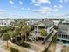 Stunning aerial view of a multi-story home showcasing beautiful design and landscaping at 707 Ocean Blvd, Isle of Palms, SC 29451