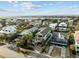 Aerial view of a neighborhood showcasing stunning homes, palm trees, and beautiful coastal scenery at 707 Ocean Blvd, Isle of Palms, SC 29451