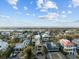 Scenic aerial view of the neighborhood and marsh with many luxury homes at 707 Ocean Blvd, Isle of Palms, SC 29451