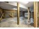 Spacious unfinished basement with concrete floor and exposed support beams at 707 Ocean Blvd, Isle of Palms, SC 29451