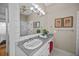Bright bathroom features tiled floors and shower, and updated vanity at 707 Ocean Blvd, Isle of Palms, SC 29451