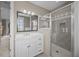 Well-lit bathroom boasts a vanity and glass shower, plus convenient access to another room at 707 Ocean Blvd, Isle of Palms, SC 29451