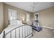 Cozy bedroom with a wrought iron bed frame, plantation shutters and in-room treadmill at 707 Ocean Blvd, Isle of Palms, SC 29451
