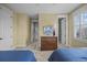 Bright bedroom includes two beds, ample storage, and sun-filled windows at 707 Ocean Blvd, Isle of Palms, SC 29451