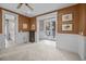 Spacious bedroom showcasing neutral carpet, access to outdoor space, and decorative trim at 707 Ocean Blvd, Isle of Palms, SC 29451