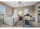 Comfortable bedroom featuring a metal bed, workout equipment and bright natural light at 707 Ocean Blvd, Isle of Palms, SC 29451