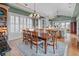 Spacious dining room features hardwood floors, chandelier, and lots of natural light at 707 Ocean Blvd, Isle of Palms, SC 29451