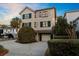 Two-story home boasts a well-maintained exterior with wood siding, green shutters, and a lovely front yard at 707 Ocean Blvd, Isle of Palms, SC 29451