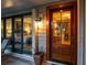 Charming front entrance with a wooden door and sidelight, offering a warm welcome at 707 Ocean Blvd, Isle of Palms, SC 29451