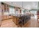 Gourmet kitchen features oversized center island with bar seating, hardwood floors, and high-end appliances at 707 Ocean Blvd, Isle of Palms, SC 29451