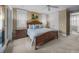 This main bedroom features a cozy carpet, a ceiling fan, and access to another room at 707 Ocean Blvd, Isle of Palms, SC 29451