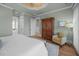 Spacious main bedroom features hardwood floors, and sitting chair at 707 Ocean Blvd, Isle of Palms, SC 29451