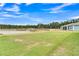 Expansive backyard with a large pond, lush greenery, and serene nature views at 733 Spring Highlands Dr, Summerville, SC 29486