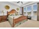 This bedroom features a wood bed frame, neutral carpet, large windows and a tray ceiling at 733 Spring Highlands Dr, Summerville, SC 29486