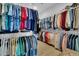 Walk-in closet features ample storage space and metal racks filled with hanging clothing at 733 Spring Highlands Dr, Summerville, SC 29486