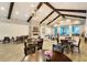 Spacious clubhouse lounge featuring vaulted ceilings, exposed beams, fireplace, and ample seating areas at 733 Spring Highlands Dr, Summerville, SC 29486