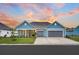Charming home featuring a two-car garage, well-manicured lawn, and inviting curb appeal at 733 Spring Highlands Dr, Summerville, SC 29486