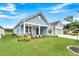 Beautiful home featuring a welcoming front porch and a well-manicured lawn at 733 Spring Highlands Dr, Summerville, SC 29486
