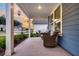 Relaxing front porch featuring comfortable seating with views of the neighborhood at 733 Spring Highlands Dr, Summerville, SC 29486