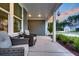 Inviting front porch with seating and lush landscaping, offering a perfect spot to relax at 733 Spring Highlands Dr, Summerville, SC 29486