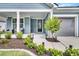 Inviting front porch with seating, landscaping, and a well-maintained exterior at 733 Spring Highlands Dr, Summerville, SC 29486