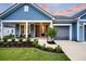 Inviting front porch with seating, detailed landscaping, and a well-maintained exterior at 733 Spring Highlands Dr, Summerville, SC 29486