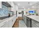 Open concept kitchen with granite counters, stainless steel appliances, and a view to the living area at 733 Spring Highlands Dr, Summerville, SC 29486