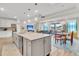 Open concept living space with kitchen, dining and living areas, providing ample space for gatherings at 733 Spring Highlands Dr, Summerville, SC 29486