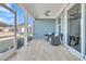 Inviting screened in porch with tiled flooring and cozy seating, perfect for enjoying the outdoors at 733 Spring Highlands Dr, Summerville, SC 29486