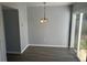 Charming dining room with modern floors, light gray walls, and sliding glass doors to the outside at 7851 Sandida Ct, North Charleston, SC 29418