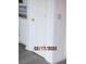 Bright hallway featuring neutral walls, flooring, and a door at 7851 Sandida Ct, North Charleston, SC 29418