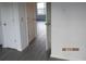 Bright hallway featuring neutral walls, flooring, and multiple doors at 7851 Sandida Ct, North Charleston, SC 29418