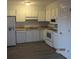 Kitchen featuring white cabinetry, appliances, and countertops at 7851 Sandida Ct, North Charleston, SC 29418
