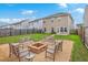 Backyard with a fire pit area including benches and gravel, perfect for outdoor gatherings at 787 Redbud Ln, Summerville, SC 29486