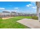 A spacious backyard showcasing a well-maintained lawn, a patio, and a fenced perimeter at 787 Redbud Ln, Summerville, SC 29486