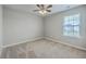 Neutral carpeted bedroom with a ceiling fan, light grey paint and a single hung window with blinds at 787 Redbud Ln, Summerville, SC 29486