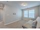 Neutral bedroom featuring carpeted floor, two windows, and a futon for seating at 787 Redbud Ln, Summerville, SC 29486