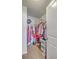 Walk-in closet with wire shelving, carpeted floor, and a variety of clothes, shoes, and storage containers at 787 Redbud Ln, Summerville, SC 29486